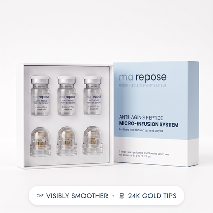 ma repose Anti-Aging Peptide Micro-Infusion System - open kit with three sealed serum vials and three capped applicator heads beside the ice blue box. Visibly smoother, 24K gold tips